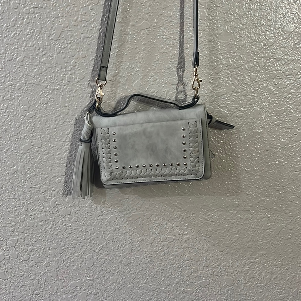 Small crossbody clutch purchased from buckle